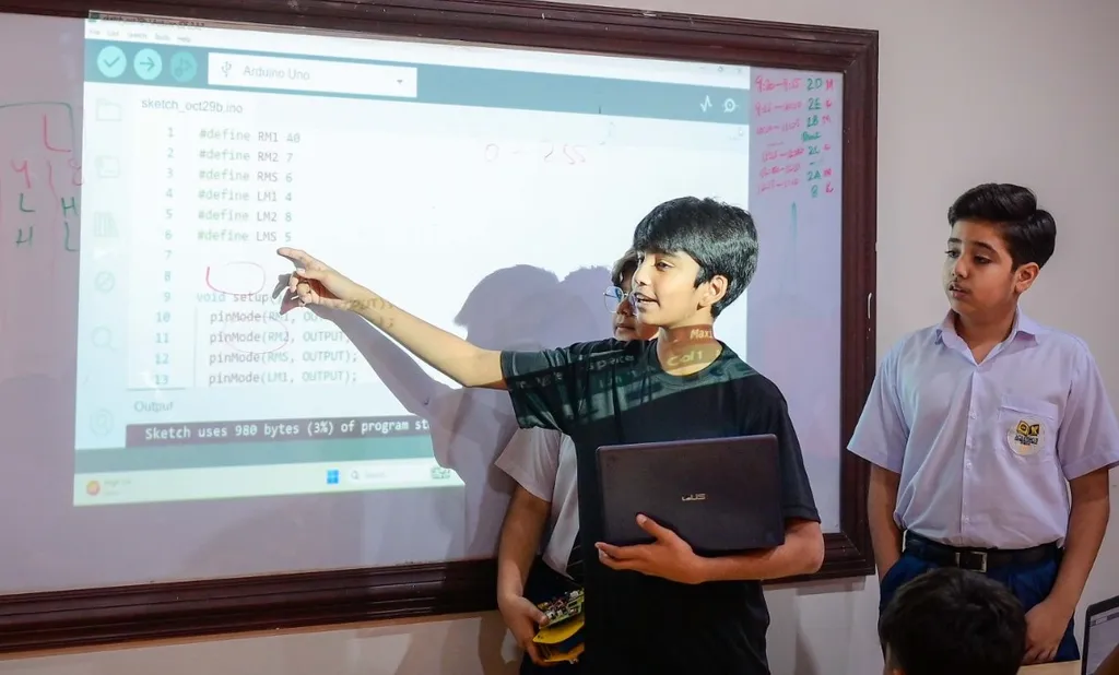 Students demonstrating coding logic